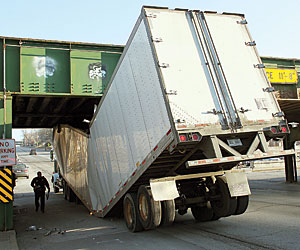 Truck hits bridge